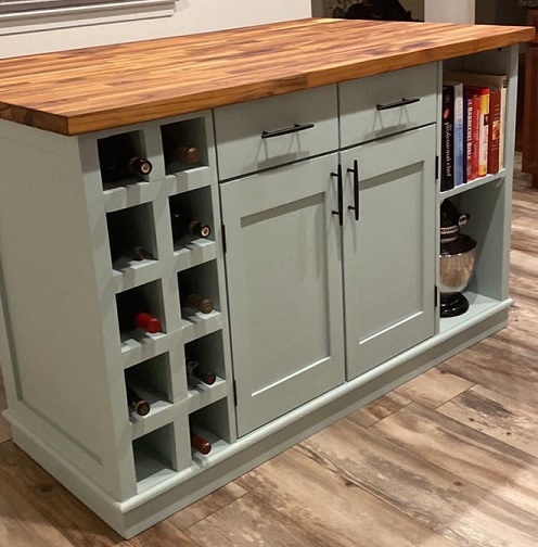 a kitchen island with a teal painted base