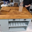 gray kitchen island with wood top