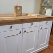 white kitchen island with wood top