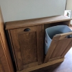 brown trash bin cabinet with one door open