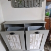 gray trash bin cabinet open