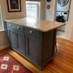 blue kitchen island with stone top