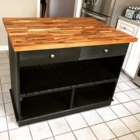 black kitchen island with wood top